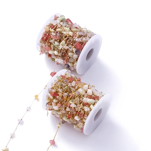 Macro view of bohemian natural stone beaded chain rolls for DIY jewelry making
