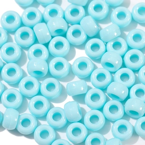 Close-up of sky blue acrylic pony beads with large holes for DIY jewelry making