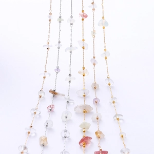 Detail of colorful natural stone chain with gold and silver beads for DIY jewelry making