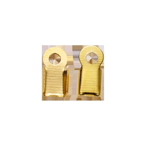 Macro view of golden metal crimp beads with hole and U-slot for jewelry making