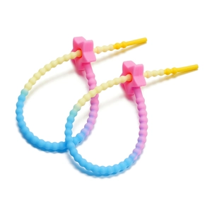 Detail of gradient silicone straps with star adjustment buckles for baby pacifiers