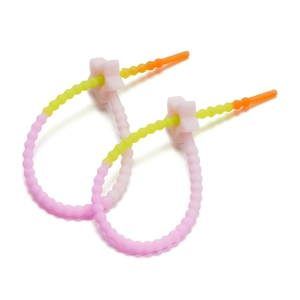 Macro detail of gradient colorful silicone star cable ties for bags and accessories