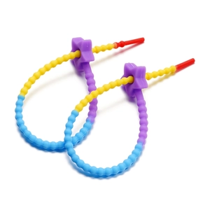 Close-up of colorful silicone baby pacifier leash with star slider and textured beads