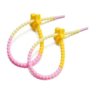Macro shot of candy-colored silicone straps with star-shaped adjustable buckles