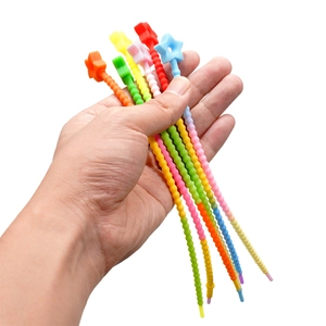 Handheld display of colorful star-shaped silicone cable ties in various bright colors