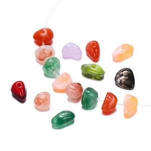Detailed macro view of multi-colored irregular acrylic beads for DIY jewelry making