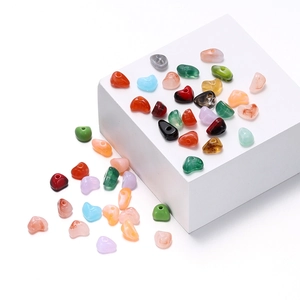 Close-up of heart-shaped acrylic beads for DIY jewelry with vibrant marbled colors