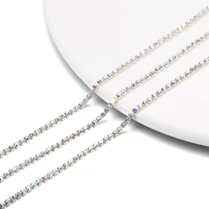 Macro shot of 2mm silver-tone claw chain with iridescent AB crystal rhinestones