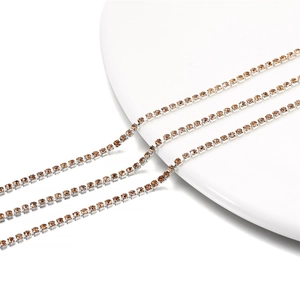 Detailed view of 2mm champagne rhinestone claw chain for DIY jewelry and accessories