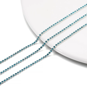 Close-up of 2mm blue crystal rhinestone chain with silver claw setting for DIY jewelry