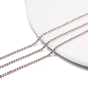 Close-up of 2mm pink rhinestone claw chain for DIY jewelry and accessory crafting