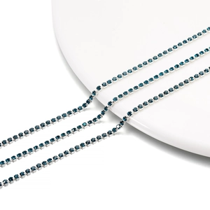 Close-up of triple-row blue rhinestone cup chain with silver-tone metal setting
