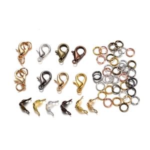 Macro view of assorted metal lobster clasps and jump rings set for DIY jewelry making