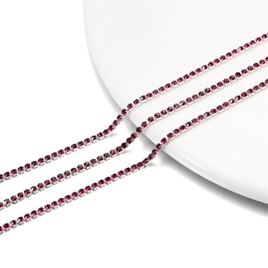 Detailed close-up of 2mm purple rhinestone tennis chain with silver metal claw setting