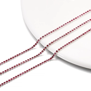 Macro shot of 2mm red rhinestone claw chain with silver metal base for DIY jewelry making