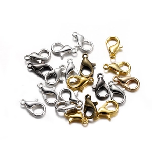 Macro shot of assorted metal lobster clasps in various finishes for DIY jewelry making
