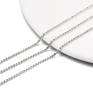 Close-up of 2mm silver dense rhinestone claw chain with clear sparkling crystals for DIY crafts