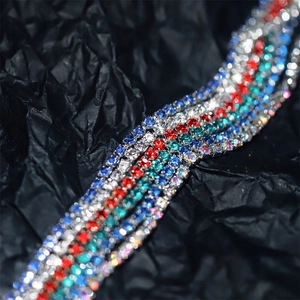 Macro shot of 2mm multi-colored rhinestone claw chains with dense crystal settings