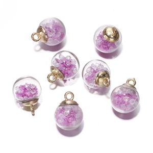 Detailed view of DIY luminous glass ball pendants with purple crystals and gold metal loops