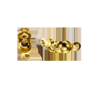 Macro detail of gold plated bead tips and calottes jewelry findings for DIY bracelets