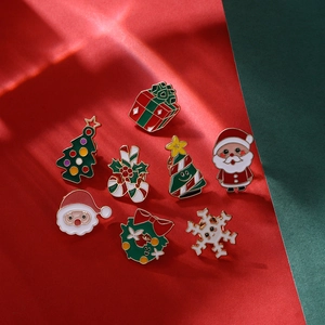 Detailed close-up of colorful Christmas alloy pins featuring Santa, reindeer and tree