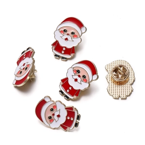 Detailed view of Santa Claus enamel pins with secure butterfly clutch metal backing