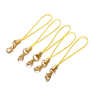 Close-up of 5 gold lobster clasp phone lanyards with yellow braided cords for DIY