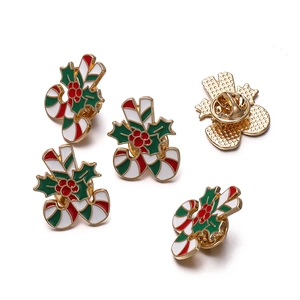 Christmas enamel pin set featuring festive candy cane and holly leaf motifs with butterfly clutch
