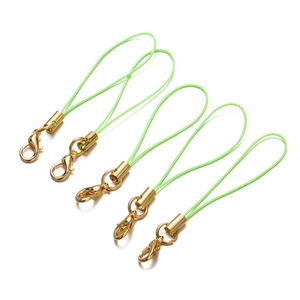 Detail of five turquoise lanyards with gold lobster clasps for DIY accessories