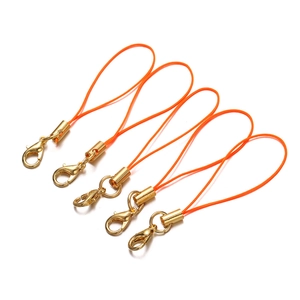 Detailed view of five orange braided nylon lanyards with golden lobster clasps for DIY