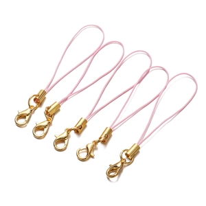 Detail view of five pink braided cords with gold lobster clasps for DIY accessories