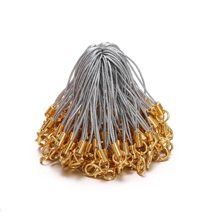 Close-up of bulk DIY lanyards with silver cords and gold lobster clasps and connectors