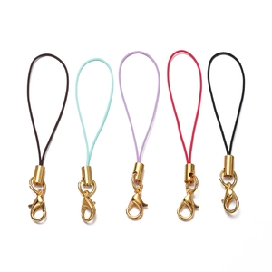 Detailed close-up of colorful lobster clasp lanyards with gold metal rings for DIY jewelry