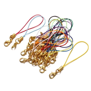 Close-up of gold lobster clasp phone lanyards with colorful braided nylon cords