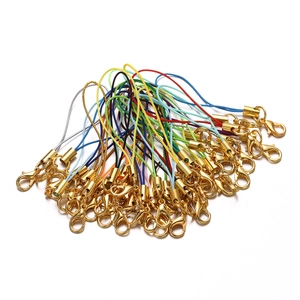 Close-up of multicolor nylon cords with gold-plated lobster clasps for DIY accessories