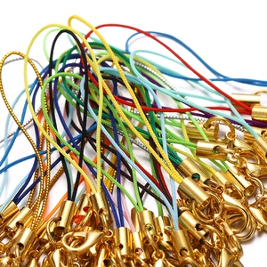 Macro shot of colorful braided lanyards with gold-plated lobster clasps for DIY jewelry