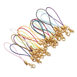Detailed view of colorful DIY phone lanyards with golden lobster clasps and metal tubes
