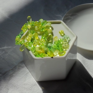Macro view of translucent green and yellow faceted beads for DIY children jewelry making