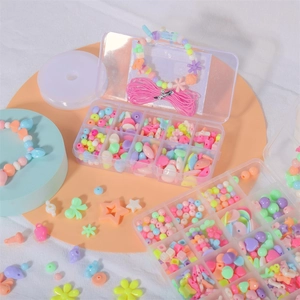 Kids DIY jewelry making kit with colorful macaron beads and elastic strings in storage boxes