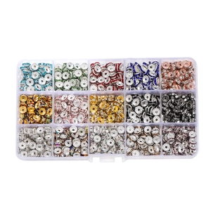 Close-up of 15-grid organizer box with colorful rhinestone spacer beads for DIY jewelry