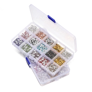 Macro detail of a 15-compartment organizer box with multi-color rhinestone spacer beads