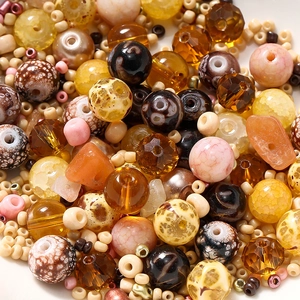 Macro view of assorted 8mm glass beads and small seed beads for DIY jewelry making