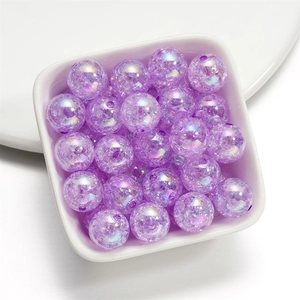 Macro detail of 16mm purple crackle acrylic beads with iridescent AB coating for DIY crafts