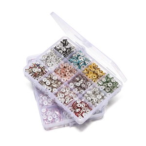 Macro shot of 15-grid storage box with colorful crystal rondelle spacer beads for DIY jewelry