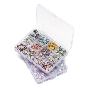 Detailed macro view of multi-color rondelle spacer beads set in clear plastic organizer