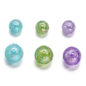 Close-up of 16mm iridescent crackle acrylic beads with central holes for DIY jewelry