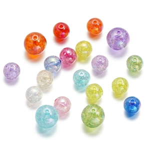 Macro detail of 16mm colorful acrylic ice crackle beads with internal texture and holes
