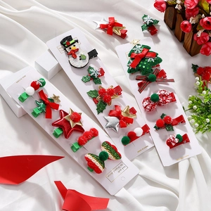 Detailed Christmas hair clips set with snowman, tree, and sequin star on cards
