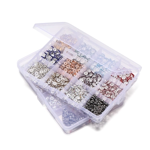 Close-up of 15-grid storage box with colorful rhinestone spacer beads for DIY jewelry