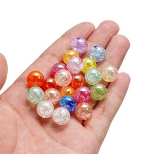 Macro detail of colorful 16mm crackle acrylic beads for DIY jewelry making and crafts